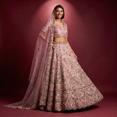Lilac net bridal lehenga with ornate embroidery, cropped blouse and sheer dupatta