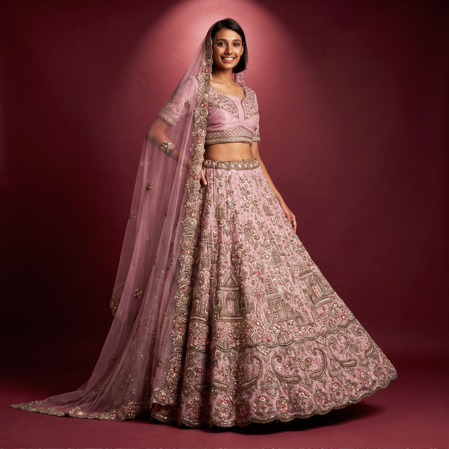 Lilac net bridal lehenga with ornate embroidery, cropped blouse and sheer dupatta