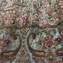 Embroidered sage green net bodice with colorful beadwork, sequins, and paisley motifs
