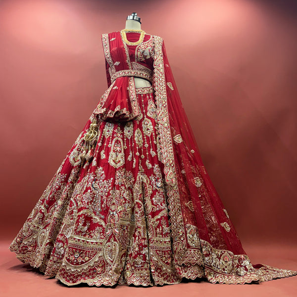 Cherry red bridal lehenga with heavy gold embroidery and double dupatta, flared skirt