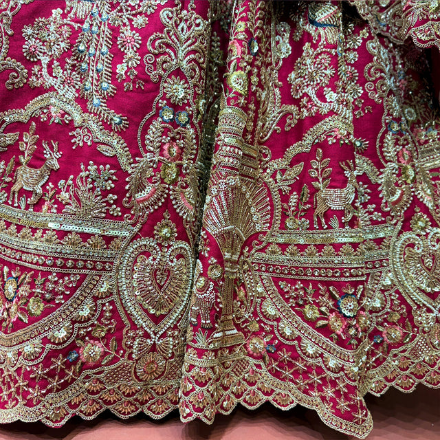 Embroidered bridal lehenga hem in rani pink with ornate gold cutdana and zardosi