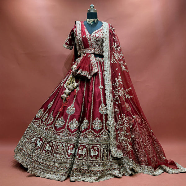 Maroon bridal lehenga with gold motifs and full flared skirt, draped net dupatta