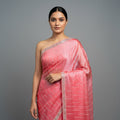 Coral tissue saree with silver sequin lines and embellished border