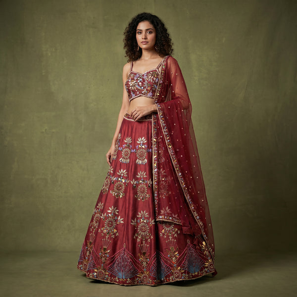 Maroon raw silk lehenga skirt with ornate mirror-and-bead embroidery and sheer dupatta