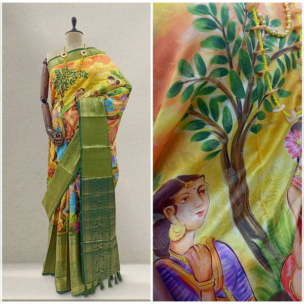 Green silk saree with multicolor ikkat-style prints, figure and tree motifs, draped