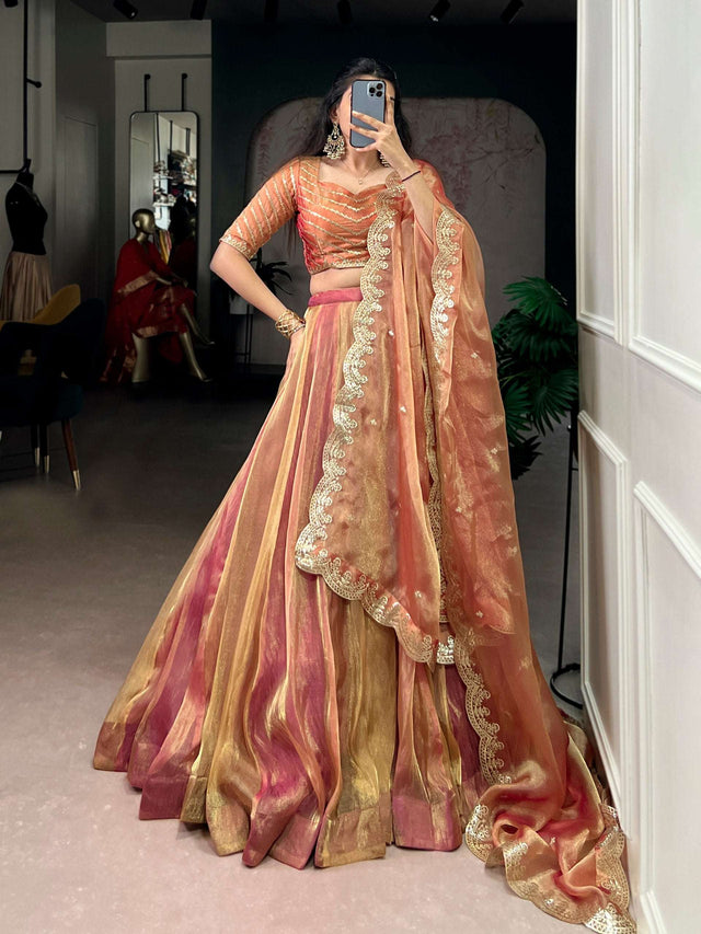 Embroidered lehenga set with striped skirt and sheer dupatta, mirror selfie angle