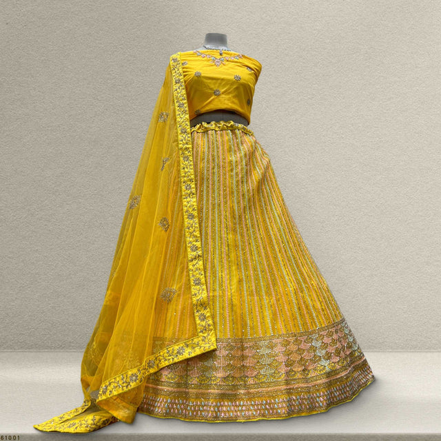 Yellow net lehenga set with embellished blouse, pleated skirt and dupatta