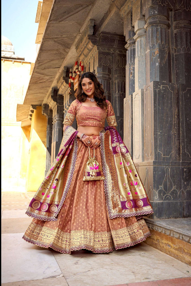 Peach shimmer organza lehenga choli with zari border and ornate magenta detail dupatta