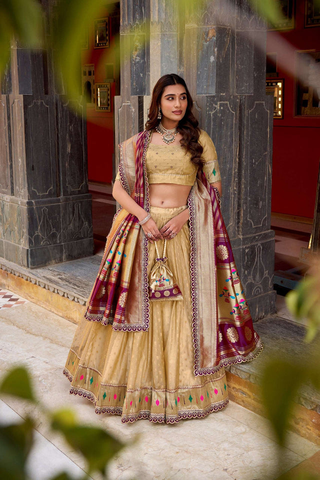 Gold lehenga choli set with purple zari border, multicolor motifs, and matching dupatta