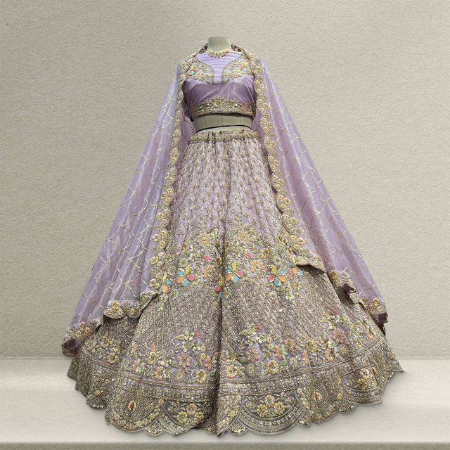 Embroidered lilac lehenga set with gold floral trim, sheer sleeves and net dupatta