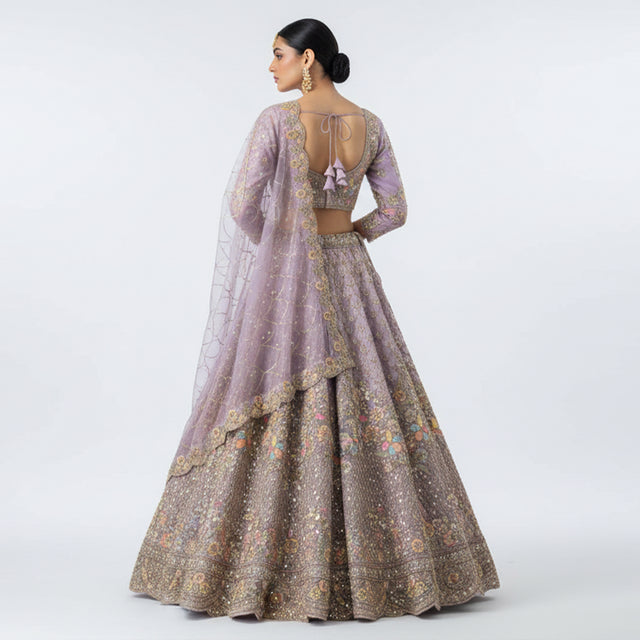 Embroidered lilac lehenga set with open-back blouse and gold floral lehenga skirt