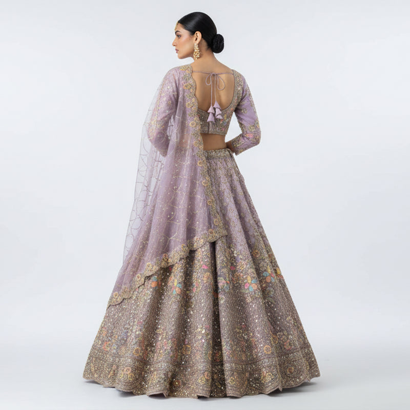 Embroidered lilac lehenga set with open-back blouse and gold floral lehenga skirt
