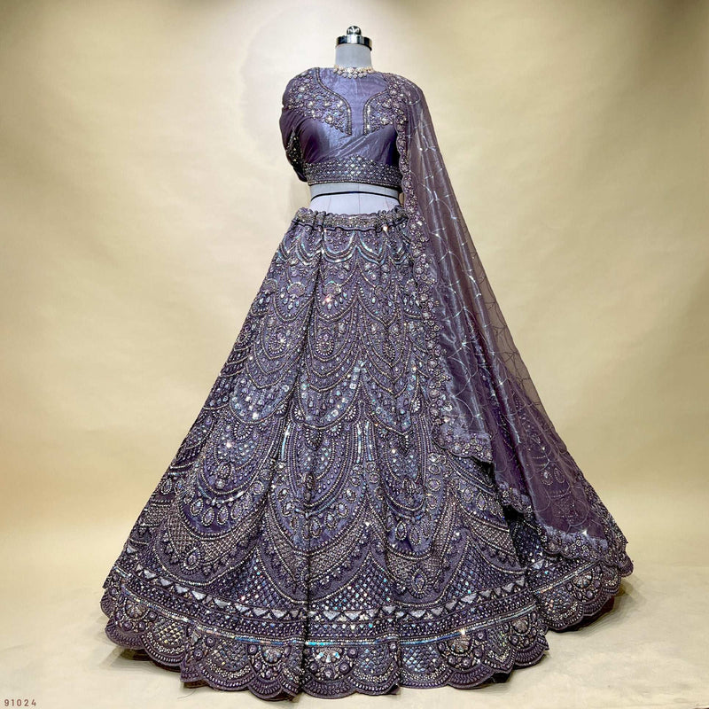 Embroidered deep purple lehenga with flared skirt, sequin bodice and long sheer net dupatta