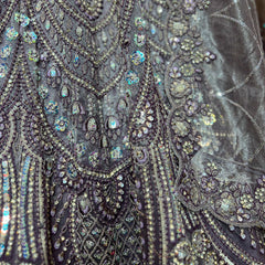 Detailed sequin and bead embroidery on deep purple lehenga bodice with floral motifs