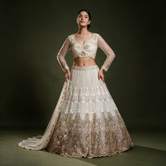 Off-white net lehenga with pearl and cutdana ombre handwork, full flare