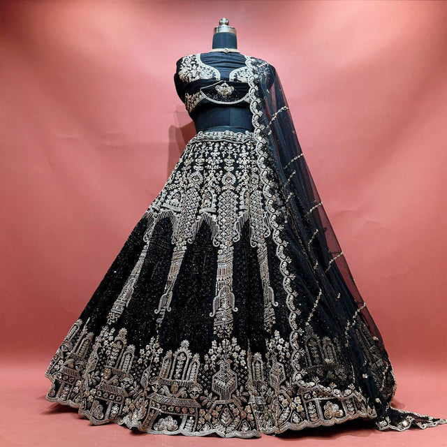 Black net lehenga with golden cutdana and pearl embroidery, scalloped hem and net dupatta
