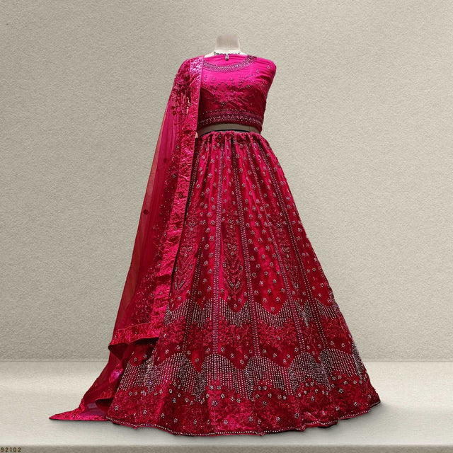 Pink sequined net lehenga with stonework bodice and flared embroidered skirt, sheer dupatta