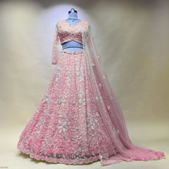 Soft pink bead-embellished lehenga skirt with matching blouse and sheer dupatta