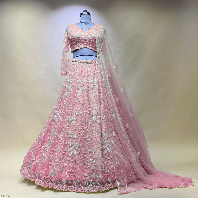 Soft pink embellished lehenga with matching sheer dupatta, bead and pearl motifs.