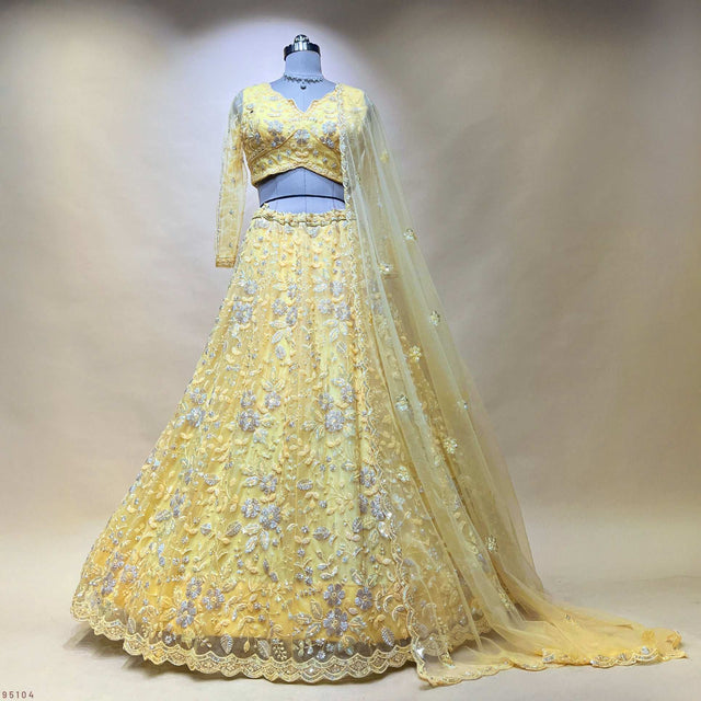 Yellow designer lehenga with beaded floral embroidery and sheer dupatta