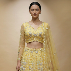 Yellow embellished lehenga set with V-neck blouse and matching full skirt