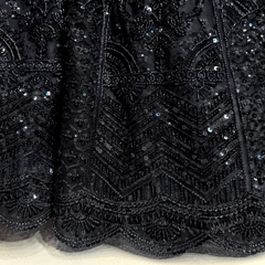 Black beaded embroidery on lehenga fabric with raised sequins and patterned motifs