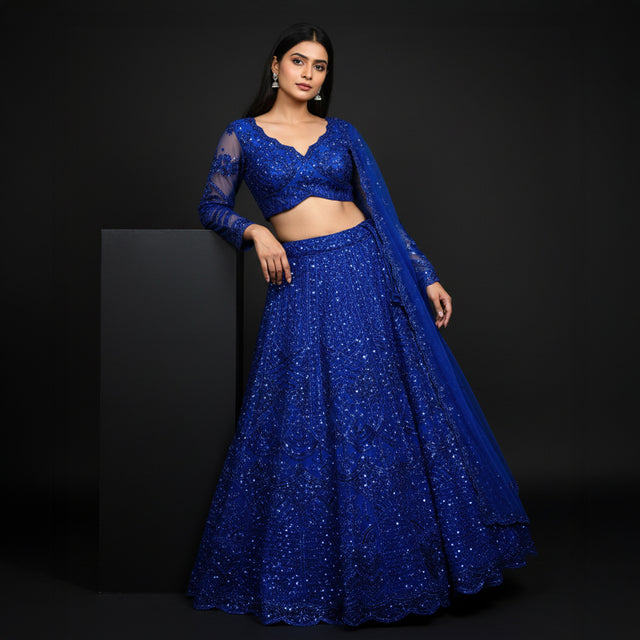 Blue sequined lehenga set with long-sleeve V-neck blouse and flared skirt