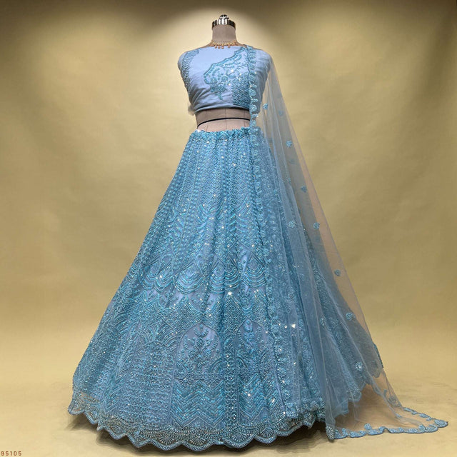 Powder blue lehenga skirt and matching blouse with sheer dupatta drape