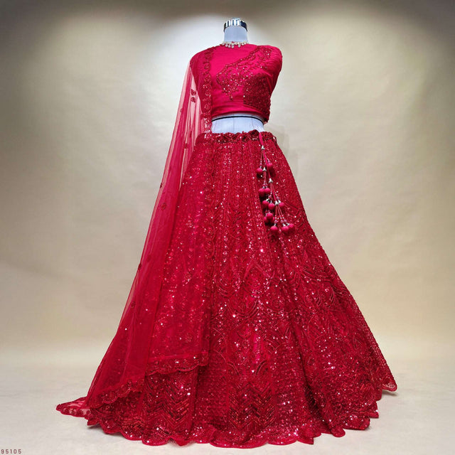 Red sequined lehenga with fitted blouse and flowing dupatta, front embellished skirt