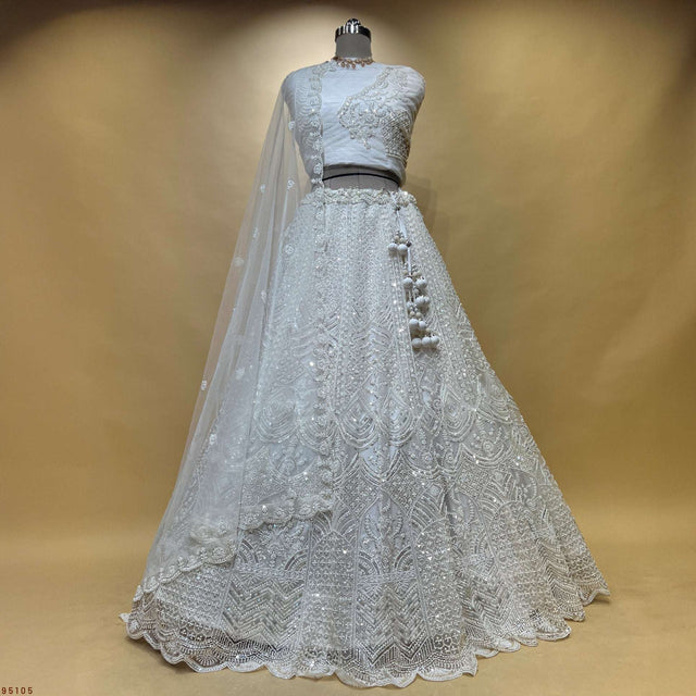 Off-white embroidered lehenga with bead and pearl embellishment, flared skirt