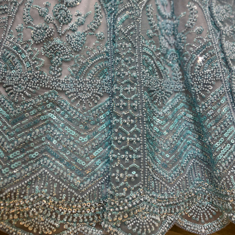 Powder blue sequin beadwork embroidery fabric close-up
