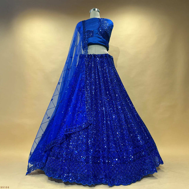 Royal blue sequined designer lehenga with net dupatta and scalloped embroidered hem
