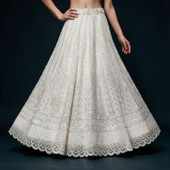 Off white net lehenga skirt with beaded chevron, scallop and diamond bands and fabric roses at the waist