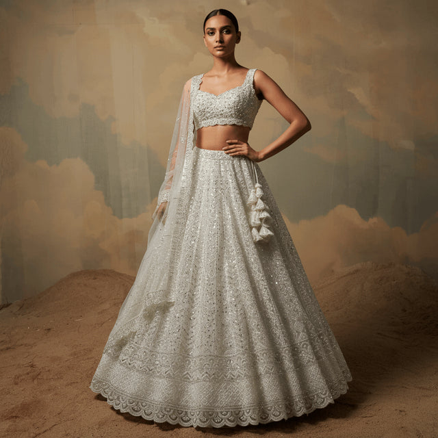 Off-white embellished lehenga dress with beaded sleeveless bodice and full skirt