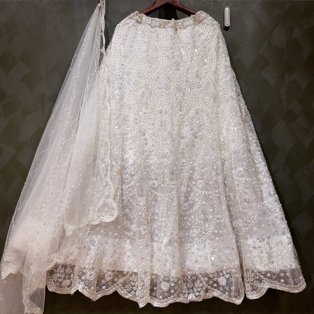 White bead-embroidered lehenga skirt with layered tulle and scalloped lace hem