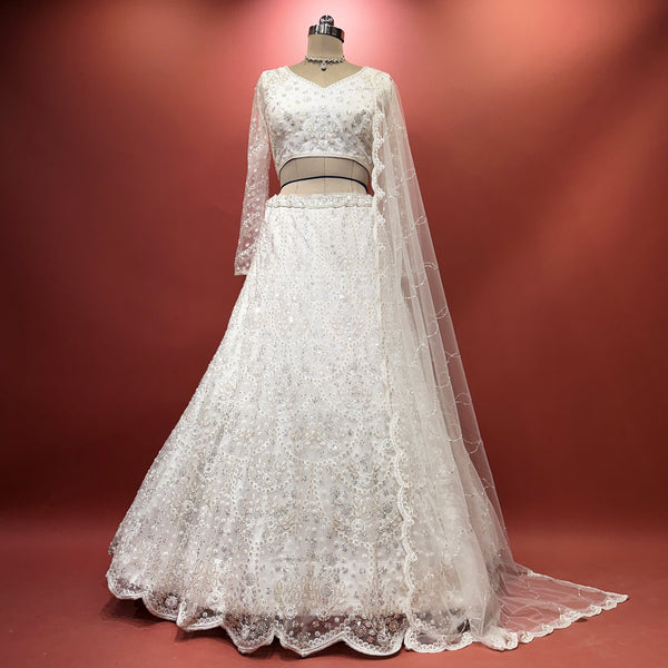 White lehenga set with embroidered bodice and sheer lace dupatta