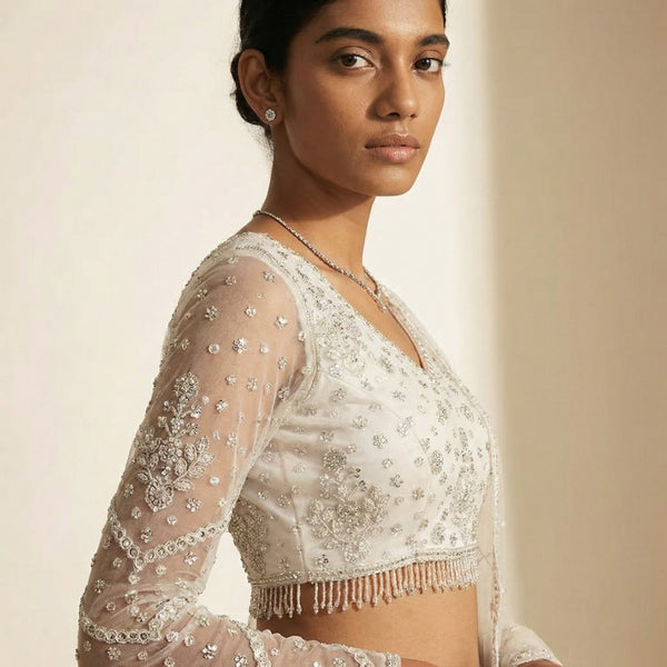 Embroidered sheer blouse sleeve with cutdana-like beadwork and tassel trim
