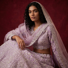 Lavender embellished lehenga with short blouse and sheer dupatta, pearl-like trim