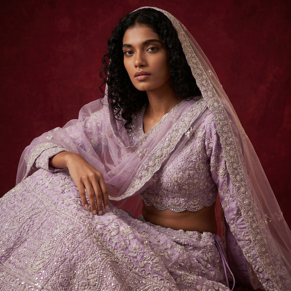 Lavender embellished lehenga with short blouse and sheer dupatta, pearl-like trim