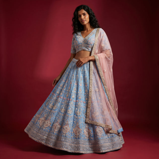 Blue embroidered lehenga with cropped blouse and sheer matching dupatta