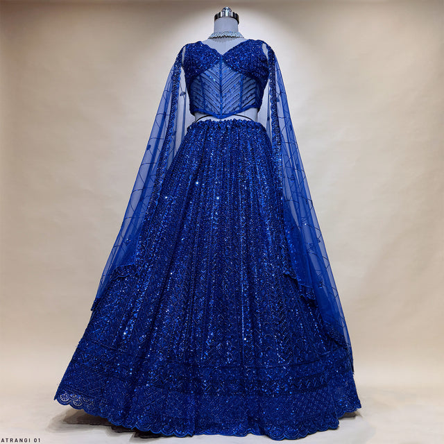 Royal blue lehenga with corset blouse and sheer long sleeves, full skirt flare