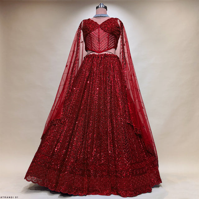 Red sequin lehenga skirt with corset blouse and sheer embroidered dupatta