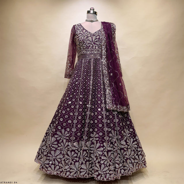 Wine partywear gown with full skirt, long sleeves and silver beadwork pattern