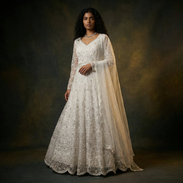 Pearl white embellished lace gown with sheer long sleeves and flowing tulle overlay