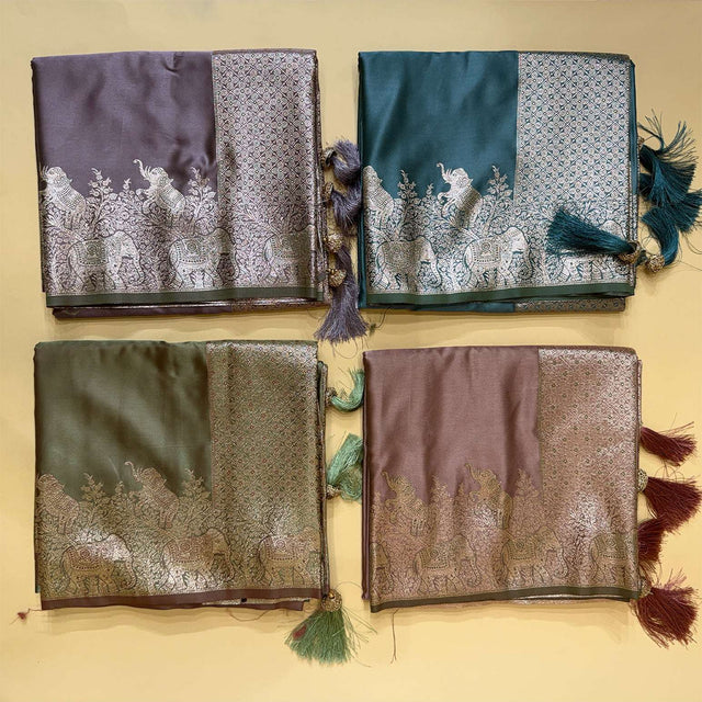 Set of four satin silk sarees with silver elephant motifs and tassel-trim borders