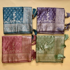 Assorted satin silk saree swatches with zari borders and floral motifs in teal, purple, maroon, green
