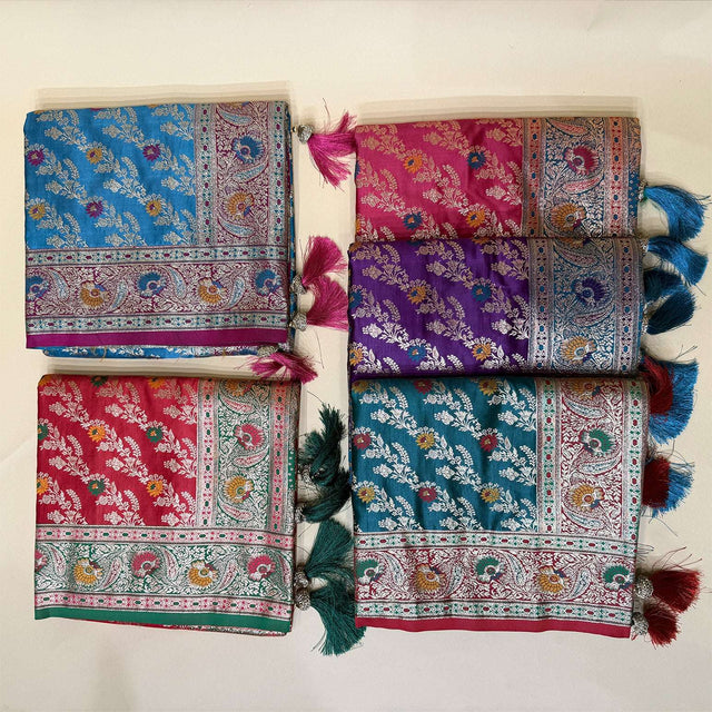 Folded leheriya-style silk sarees with contrast borders, blue and purple floral motifs