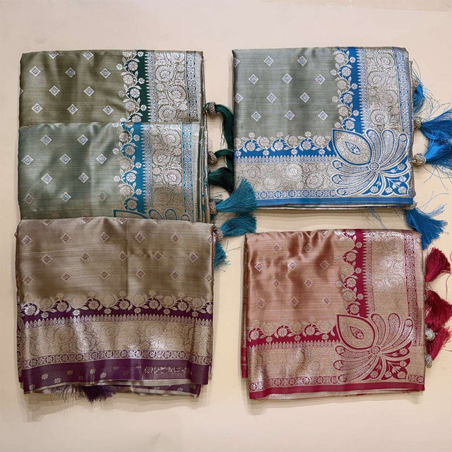 Folded satin silk saree pieces with blue and maroon zari borders on grey base