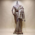 Dual-shade satin silk saree with zari border pallu, lavender detailing, tassel trim