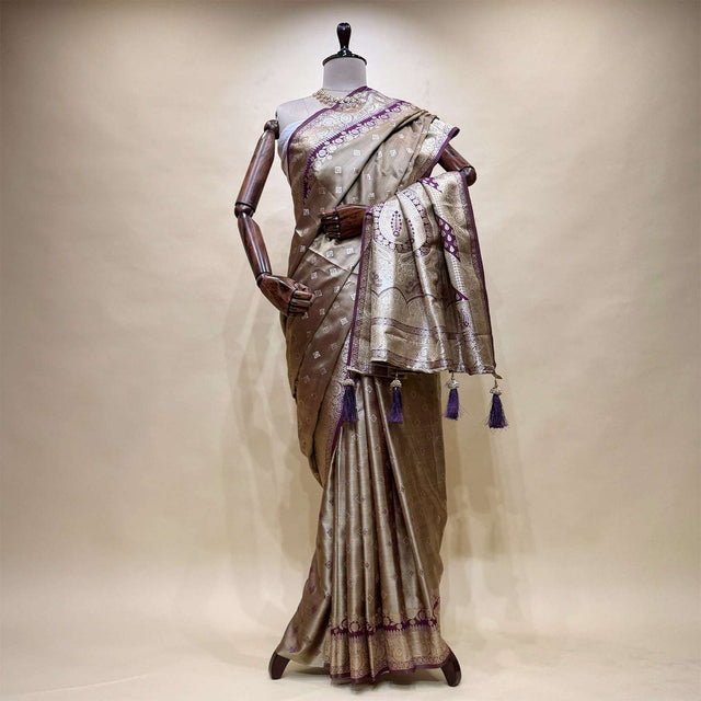 Dual-shade satin silk saree with zari border pallu, lavender detailing, tassel trim